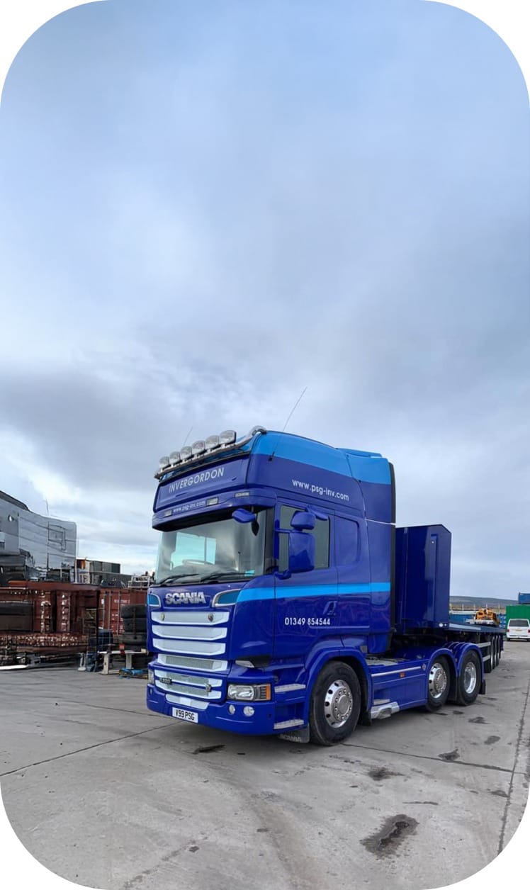 Specialist lifting operation with heavy-duty truck at construction site