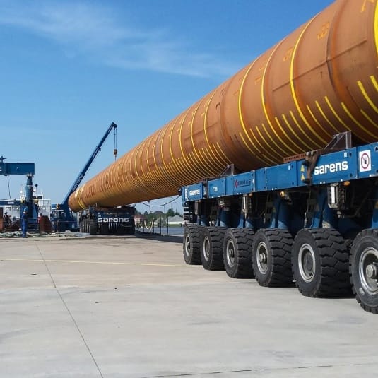 Wind turbine tower section loaded on SPMT trailer