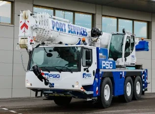 Lifting operation with mobile crane on construction site