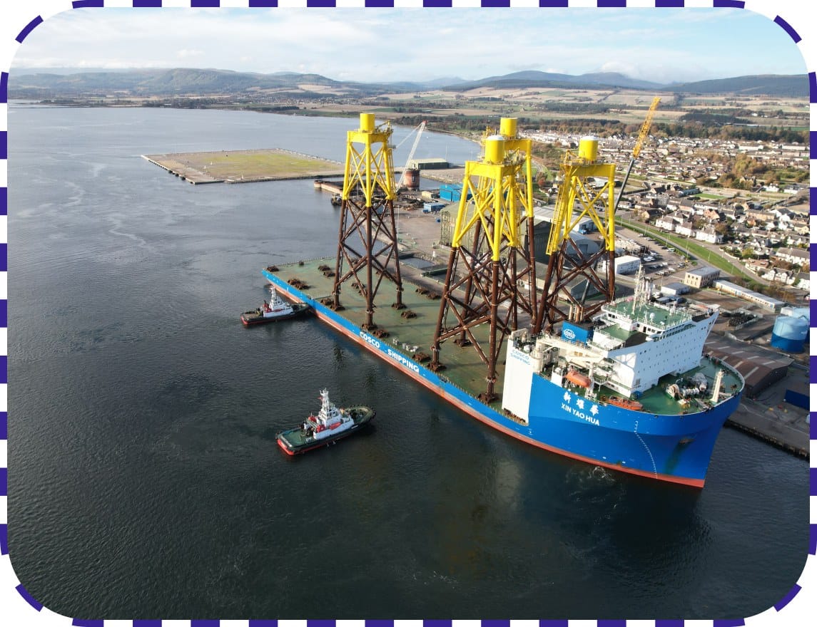 Crane loading equipment onto ship at port service dock