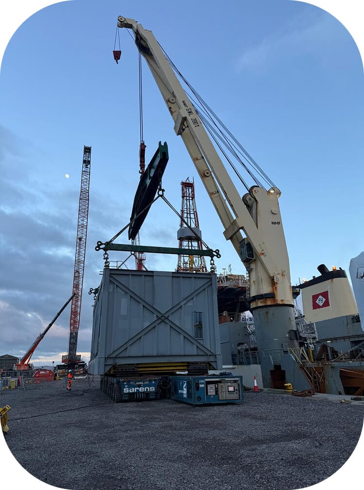 Crane lifting 100-tonne CTU during load-out at Invergordon Service Base